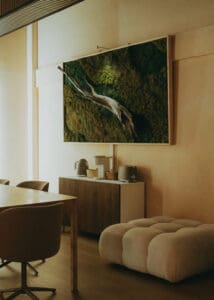 Solace Studio lounge and meeting space with wood table, chairs, and warm natural light photographed for Orlando wellness branding photography.