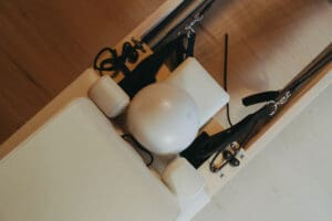 Pilates reformers arranged inside Solace Studio in Orlando with warm lighting and arched mirrors for wellness branding photography.