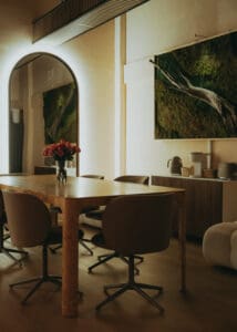 Solace Studio lounge and meeting space with wood table, chairs, and warm natural light photographed for Orlando wellness branding photography.